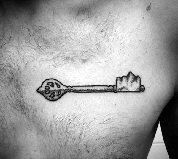 Key tattoo on chest for men