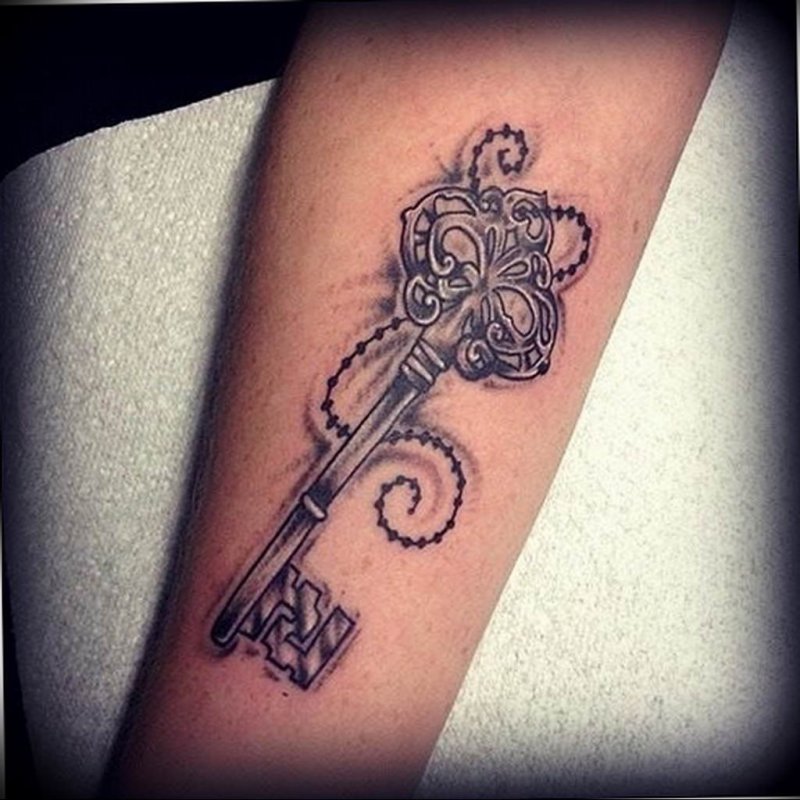 Key tattoo on the arm for men