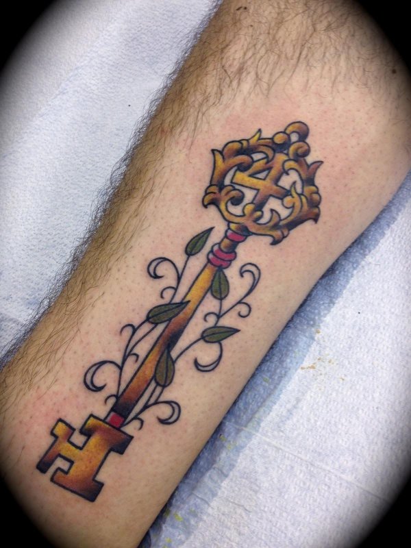 Key tattoo on the leg for men