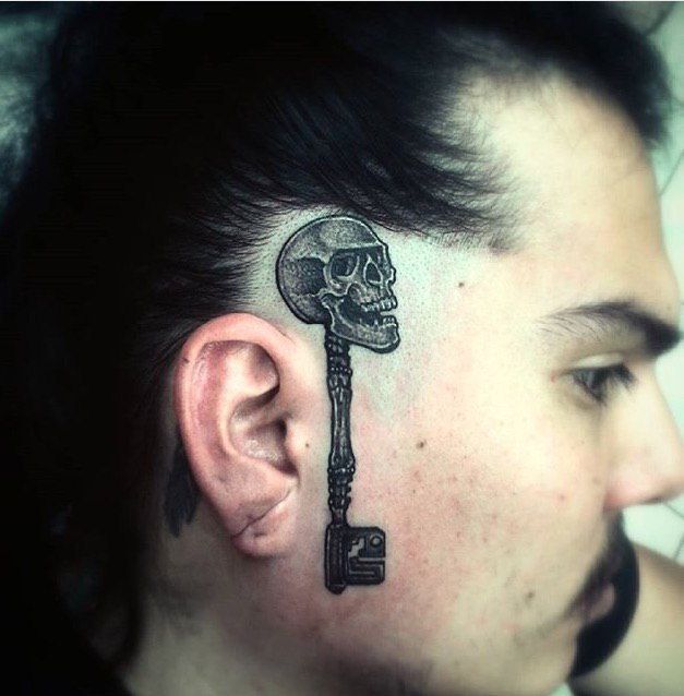 Key tattoo on face for men