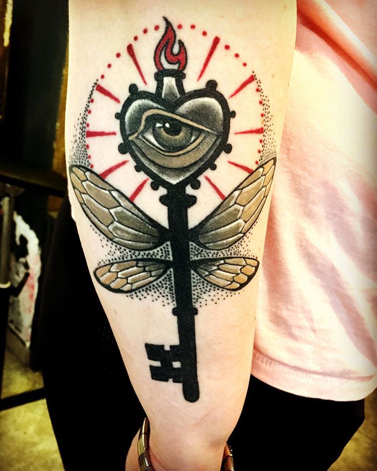 Large key tattoo on the arm for men