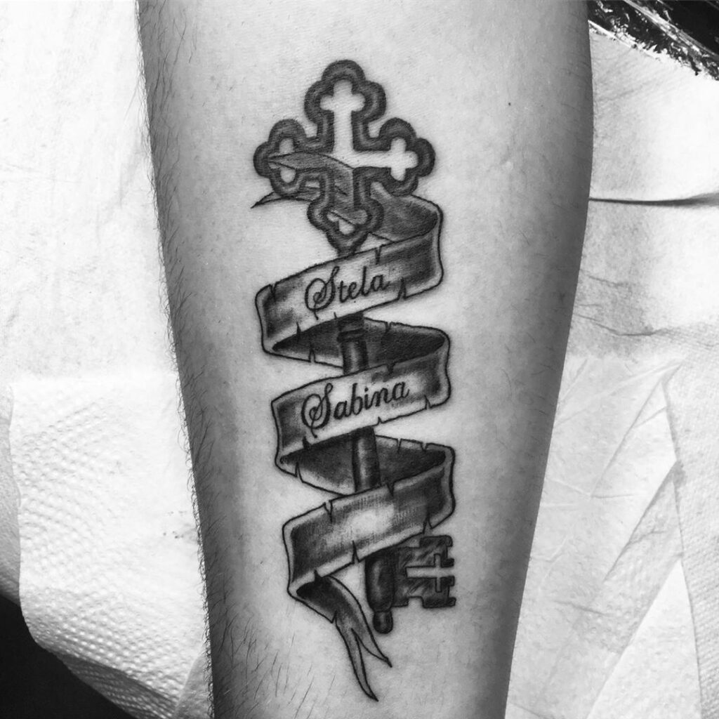 Key tattoo with inscription on the arm for men