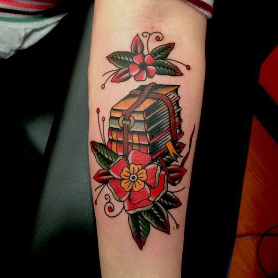 Book tattoo on the arm for women