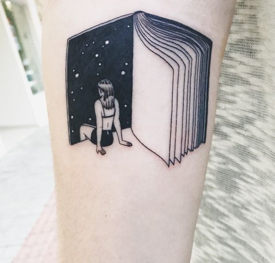 Book tattoo on the arm for men