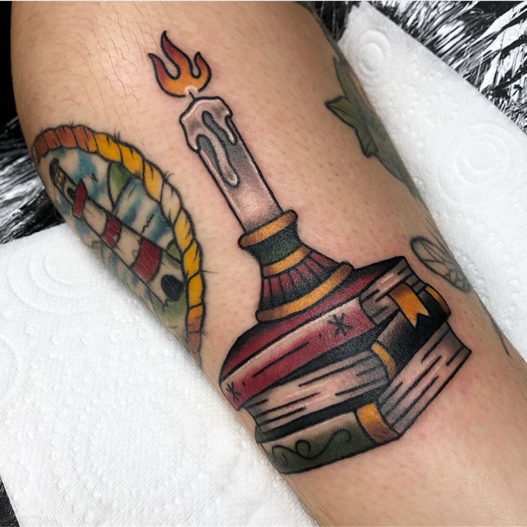 Colorful book tattoo on leg for men