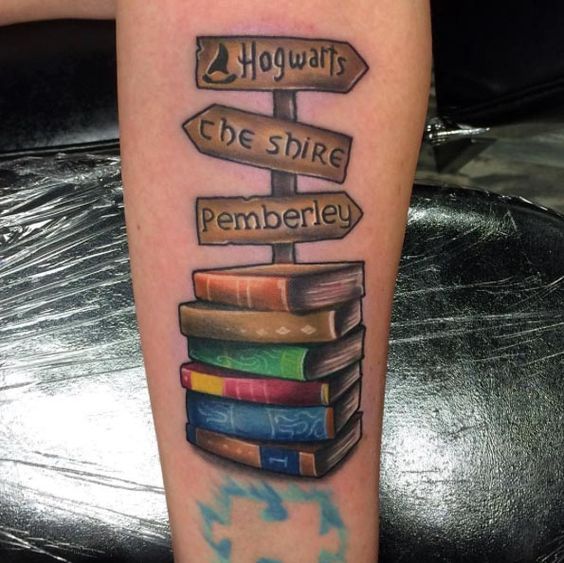 Book tattoo with writing on the leg for men