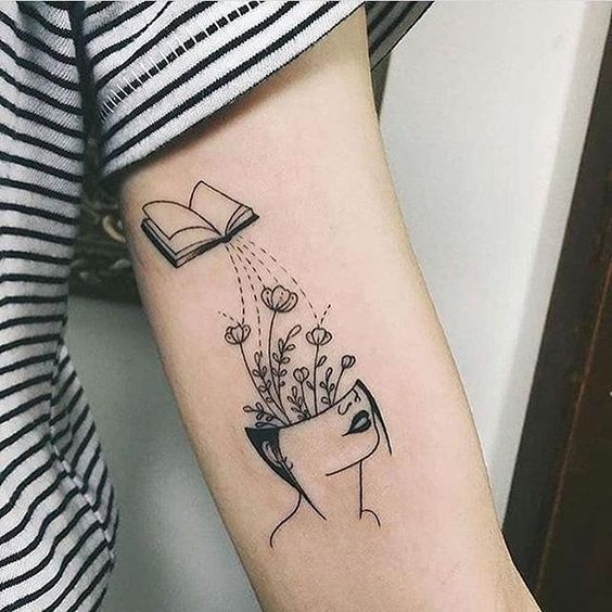 Book tattoo on the shoulder for women