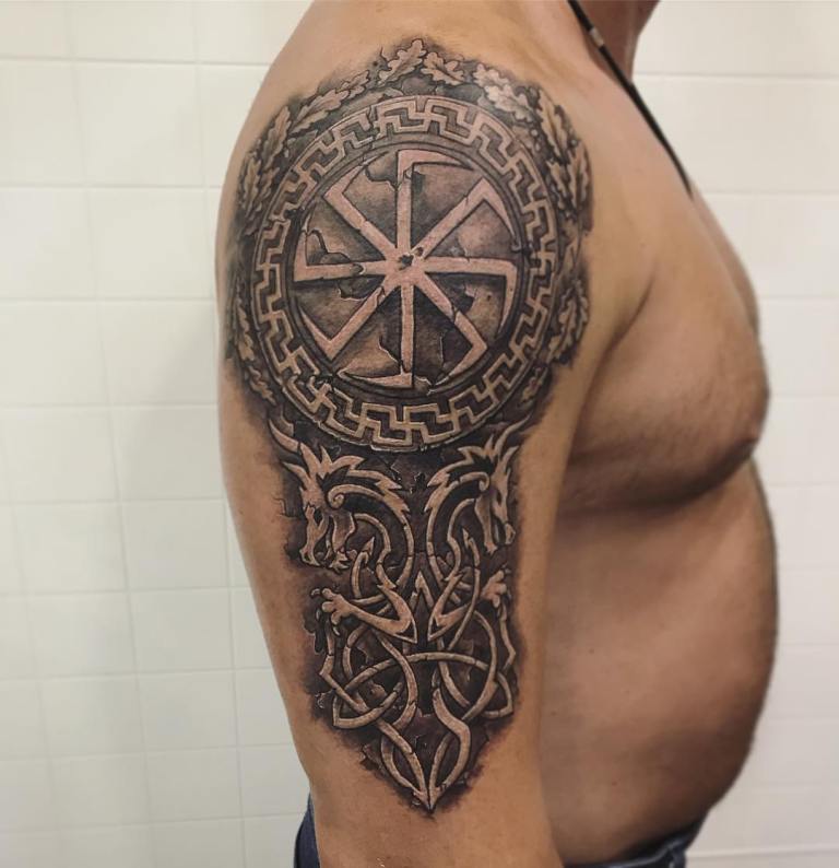 Kolovrat tattoo on the shoulder for men