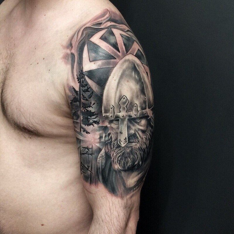 Kolovrat tattoo on the shoulder for men