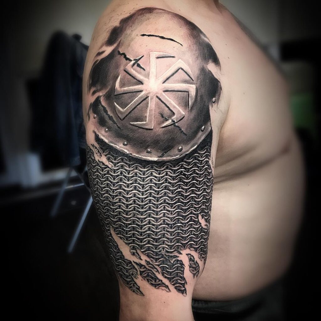 Kolovrat tattoo on the shoulder for men