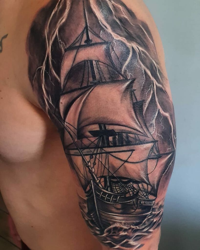 Ship tattoo on the shoulder for men