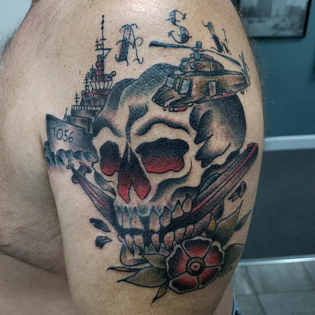 Ship and skull tattoo on the shoulder for men