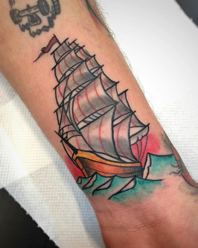 Ship tattoo on the arm for men