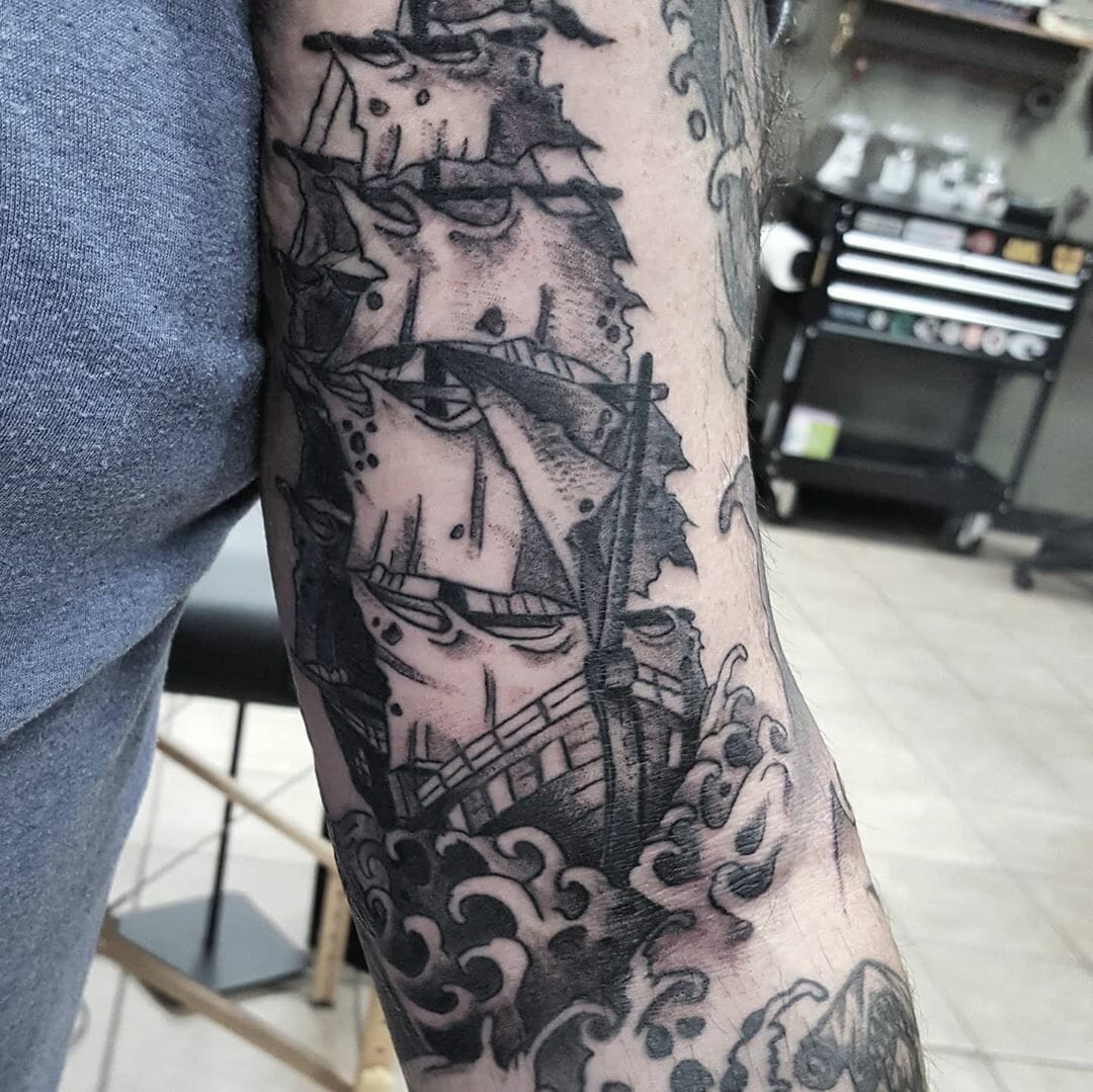 Ship tattoo on shoulder for women