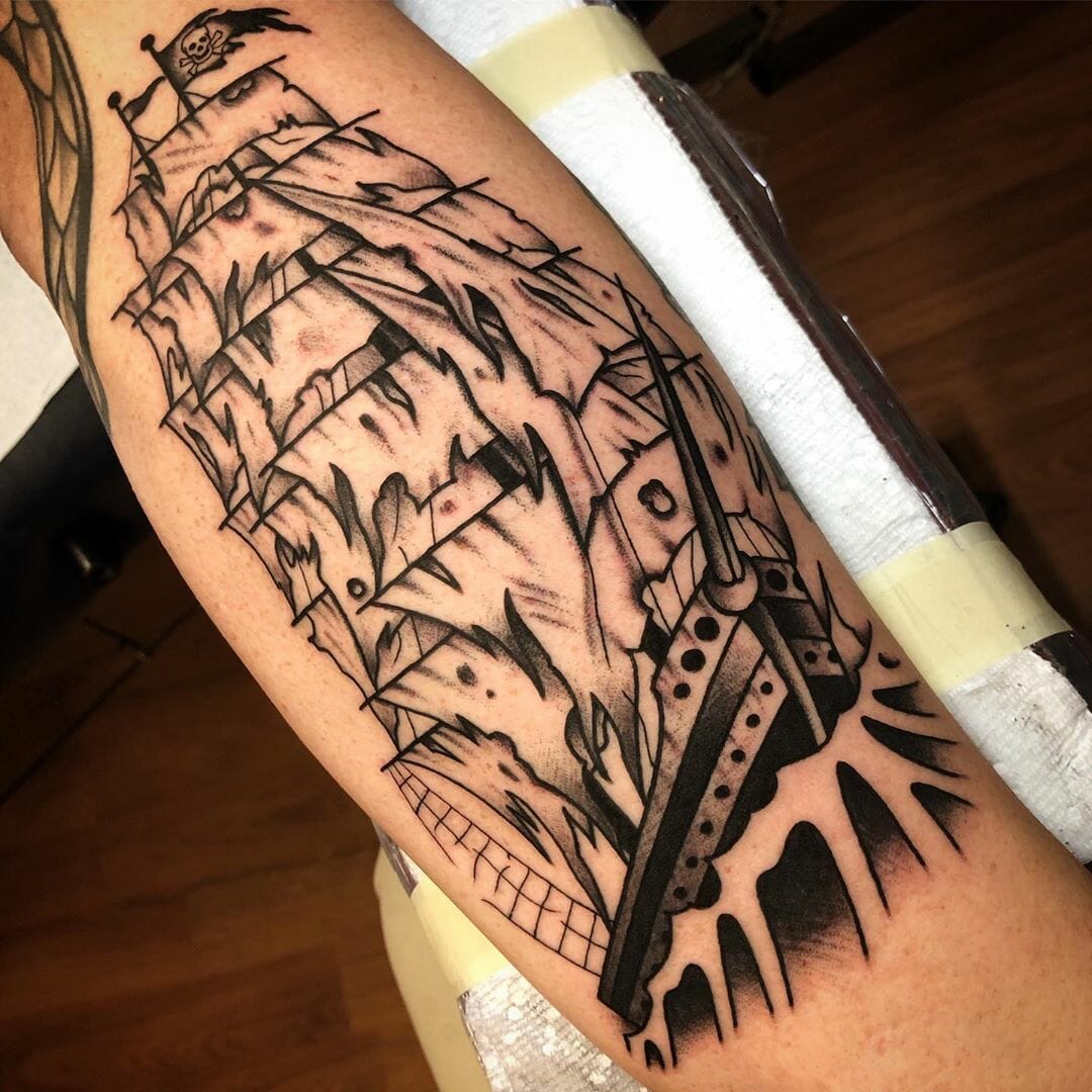 Ship tattoo on the arm for men