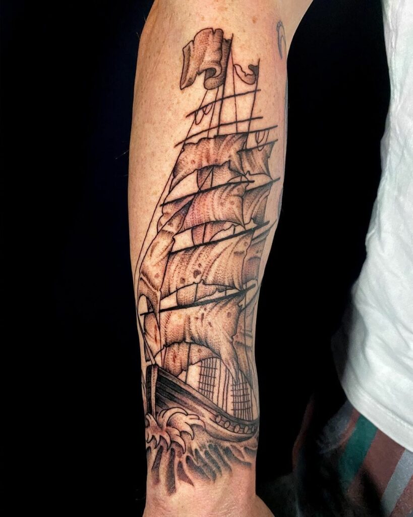 Ship tattoo on forearm for men