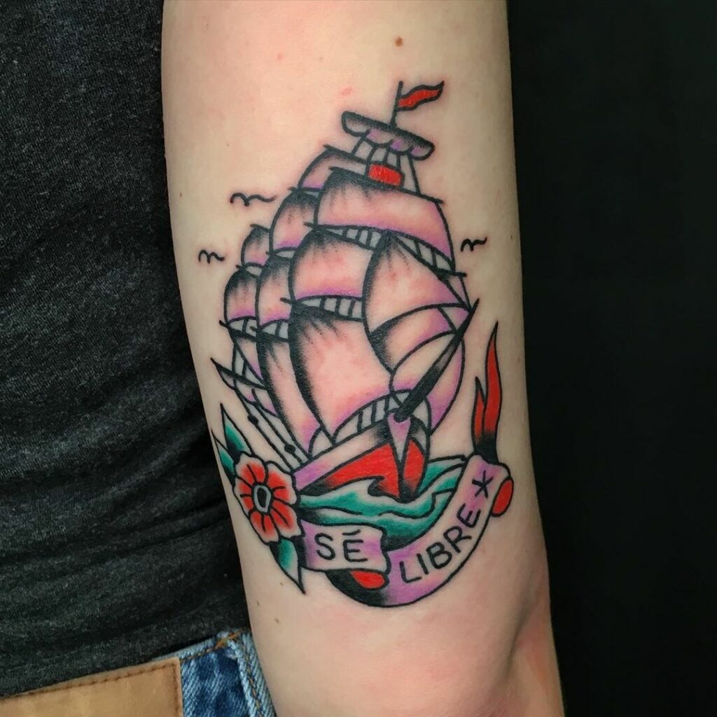 Colorful ship tattoo on shoulder for women