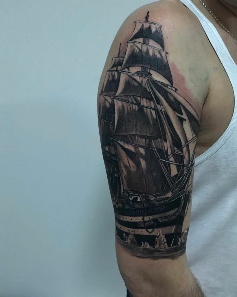 Ship tattoo on the shoulder for men