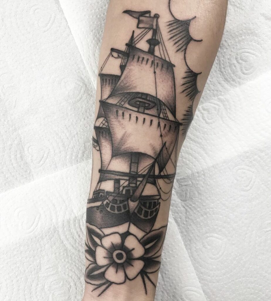 Ship tattoo on forearm for women