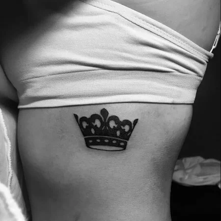 Crown tattoo on the side for women