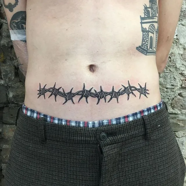 Barbed wire tattoo on abdomen for men