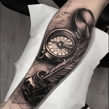 Compass tattoo on forearm for men