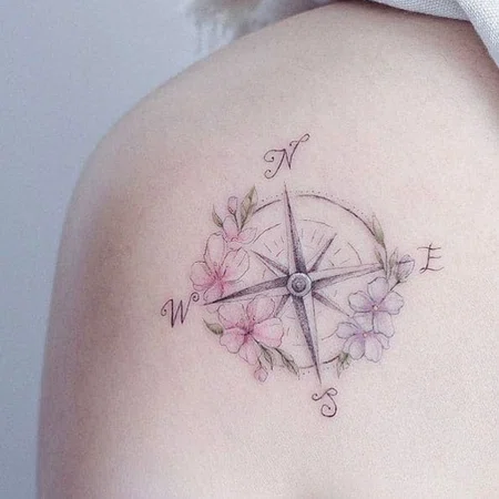 Compass tattoo on the shoulder blade for women